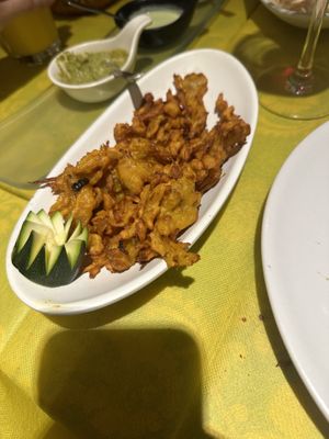 Fried onions in chickpea batter- yum  at Ristorante Indiano Crown of India in Florence