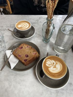 Oat milk cappuccino and raspberry loaf cake  at Five Ways Coffee in Amsterdam