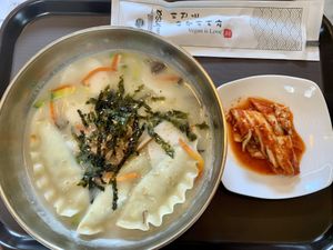 Rice cake soup with complimentary kimchi! Super delicious, perfectly seasoned!  at Vegan Insa - 비건인사 in Seoul