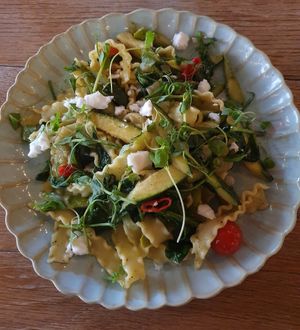 MAFALDINI PRIMAVERA: Ruffled Ribbon Pasta, Asparagus, Courgette, Cherry Tomatoes, Lemon, Herbs, Feta-Style Vegan Cheese at Victors in Alderley Edge