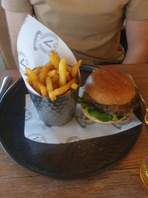 MOVING MOUNTAINS VEGAN BURGER: Applewood Vegan Smoked Cheese, Vegan Mayonnaise, Salad, House Bun, Fries at Victors in Alderley Edge