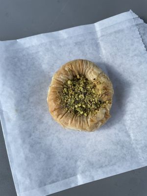 Vegan dessert. I think this was called a “vegan bracelet.” It is pistachio with puff pastry    at Asali Desserts & Cafe in Cary