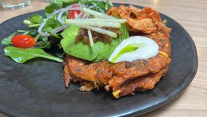 Corn fitter pancakes with kimchi , large size meal. Yummy flavour and fresh salad.  at Back to Eden in Central Singapore