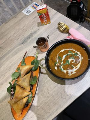 Veg samosas and butter chicken  at Vegan Dhaba in Birmingham