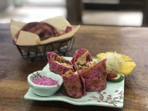 Lemon chicken red burrito with snow cake in background  at Red Dragon Fruit Burrito in Hengchun