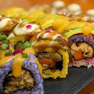 Vegan Roll in Calimix: Stir-fried vegetables and avocado, topped with grilled zucchini and eggplant alongside vegan mayonnaise at SushiLAB in Hanoi