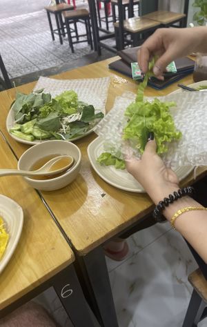 Rolling a pancake   at Khai Tâm  in Ho Chi Minh City