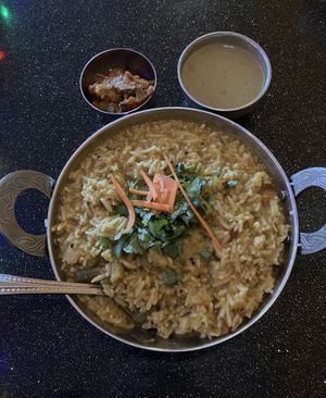 Sambar Rice (basmati rice cooked with lentils, vegetables & sambar). Subbed Mango Chutney for Raita which is not vegan. Very good. at Aroma Indian Cuisine in Bloomington