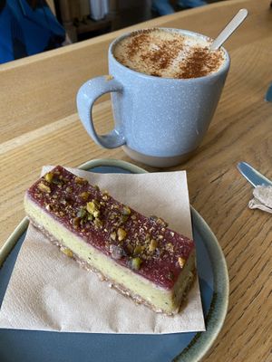 Pistachio raspberry cheesecake and dirty chai latte   at Little Collins CBD  in Dublin