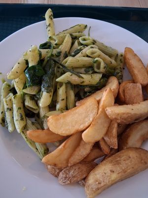 Spinach pesto pasta and chips (free side) at Seed Cafe in North West London