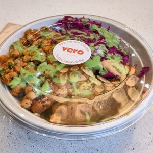 Brown ride base with sweet potato, cauliflower, pickled cabbage and spiced chickpeas and green goddess dressing. at Vero in Belfast
