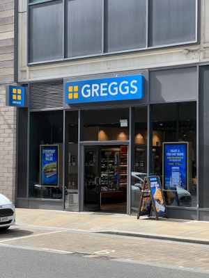 Exterior and inside seating  at Greggs in Salford