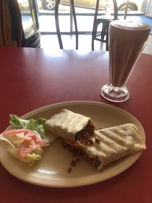 Burro de desayuno- chorizo and tofu. Strawberry milkshake with soya milk   at Om Burger Rincon Vegetariano in Zacatecas
