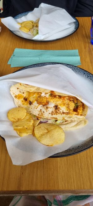 Flatbread with falafel, hummus, avocado, vegan mayo, spicy pepper sauce at Bongou Cafe in Edinburgh