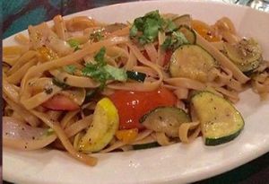 Garlic Ginger noodles tossed with seasonal veggies in a soy aji seasoning. at Qusqo in West Los Angeles