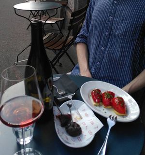 Right: paprika filled with vegan chives-cream cheese on cracker. Left: smoked dates with chewy wrapping. at COR in Zurich