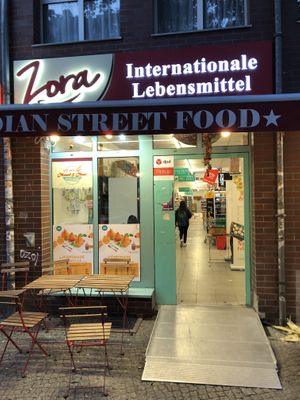 Storefront with seating area.  at Zora in Berlin