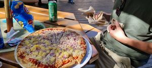 Half/half vegan pizza with garlic oil, onions, one half pinapple at Curry Village Pizza Deck in Yosemite Valley