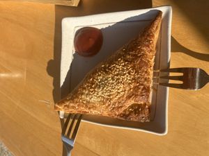 Spinach and feta triangle   at Jing Si Books & Cafe  in Salisbury