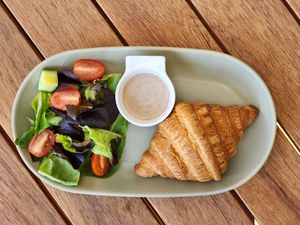 Experience our incredible vegan croissant, crisp salad, and our signature sauce! 🌱✨ 
Our unique sauce, enriched with Jing Si Multi-Grain Powder at Jing Si Books & Cafe  in Salisbury