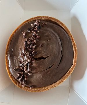 Chocolate tart (takeaway)  at Jing Si Books & Cafe  in Salisbury