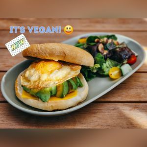 Bagel Delight w/ vegan sunny-side-up at Jing Si Books & Cafe  in Salisbury