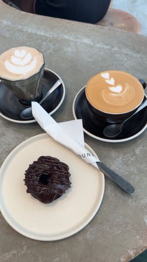 Chai latte, latte macchiato and chocolate doughnut   at Grounded  in El Nido