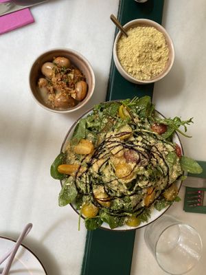 Cashew parmesan (top right), gnocchi (left) side salad (front)  at Pastan Barcelona in Barcelona