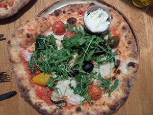 Vegan Sommerpizza with vegan garlic dip. at Martinerhof's Brauhotel in St Martin In Passeier