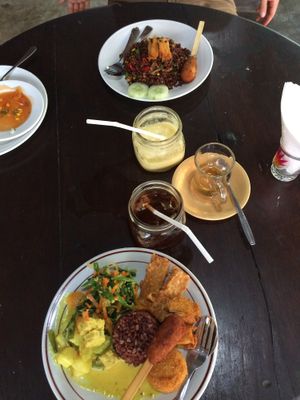 Nasi campur (front), Nasi goreng (back). pineapple juice and ice tea! everything very delicious! at Siboghana Waroeng in Ubud