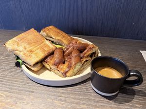 Mushroom focaccia, cinnamon bread and double espresso    at Ole & Steen in London