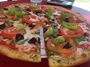 Gluten-free Michelangelo: spinach, olives, green bell peppers, mushrooms, tomatoes at Landini's Pizzeria in San Diego