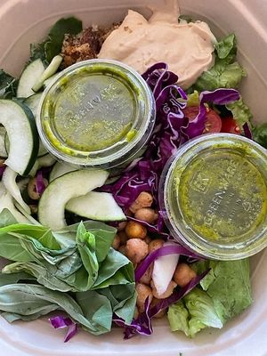 Hummus Crunch Salad: Hummus, olives, chickpeas, tomatoes, cucumbers, shredded cabbage, red onions, basil, za’atar breadcrumbs, chopped romaine, shredded kale, pesto vinaigrette at sweetgreen in Schaumburg