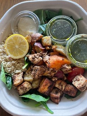 Mediterranean Mezze Warm Bowl: swap chicken for tofu, hot roasted sweet potatoes, hummus, chickpeas, olives, tomatoes, basil, warm quinoa, baby spinach, lemon squeeze, pesto vinaigrette at sweetgreen in Schaumburg