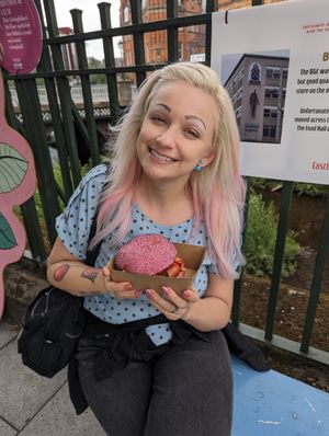 Vegan hot dog in a pink burger bun, why not! at Junk Soul Smothered Bar & Grill in Beverley
