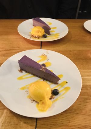 Cheesecake with Mango Sorbet  at Gratitude Restaurant in Munich