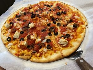 Vegan chicken with black olives and onions…vegan cheese too!  at Congress Pizza in Ishpeming