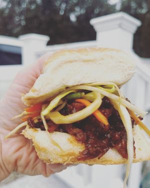 Our vegan version of a barbecue pulled pork sandwich with our signature Asian slaw at Umami Pizza & Fusion in Dennis