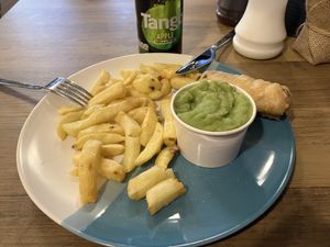 Vegan battered sausage, chips and mushy peas  at Holt Fish Bar in Holt