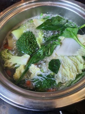 Veggie hot pot cooking at Hot Pot Legend in Ashburn