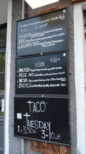 Menu at the front of building at Taco Meister in Berlin