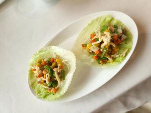 Stir fried vegetables w sweet corn and pine nuts in lettuce at Lung King Heen in Hong Kong Island