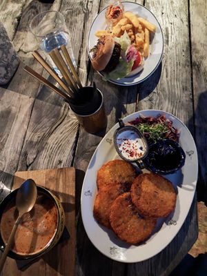 Soup, potatoe pancakes with jam and salad, beyond burger with fries at Valhalla Wine & Coffee, kafejnīca in Liepaja