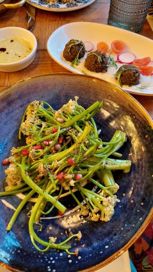 Grilled caulilini and falafel at Agora DC in Washington