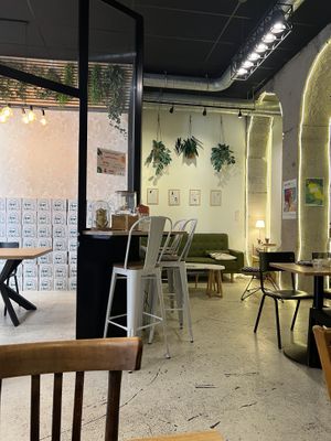 The Great Wall of minor figures oat milk boxes! Also the chill interiors  at ZEITGEIST Café in Lyon