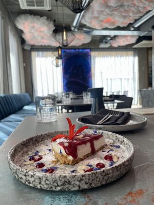 Vegan cheesecake with homemade Cherry sauce.   at Izakaya in Tallinn