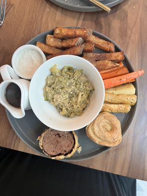 Beef Wellington with an assortment of veggie sides  at Maiden: Fine Plants & Spirits in Fort Worth