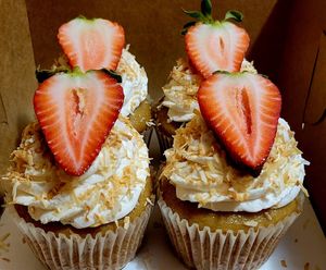Vanilla cupcakes with toasted coconut and strawberries. at Tia Mom's Cocina - Pre-order only in Albuquerque