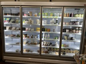 Refrigerated section with vegan yogurts, cheeses, meats, etc  at Health Zone in South West London