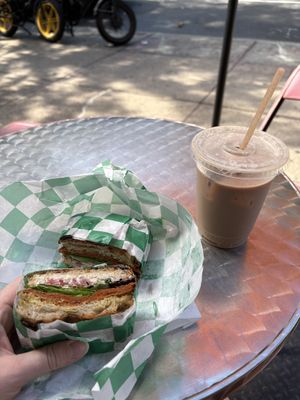 Foccaciaboutit sandwich with ice chai latte  at Yough in Brooklyn